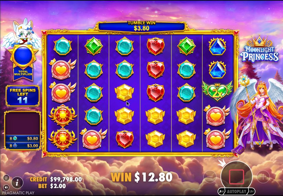 A green winged heart marked 2x on the right reel during free spins, with 11 spins left and a 3.80 tumble win.